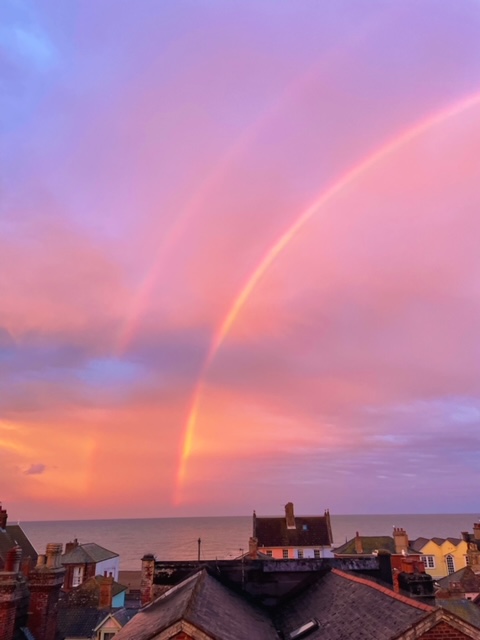 A picture containing sky, outdoor, nature, rainbow
Description automatically generated